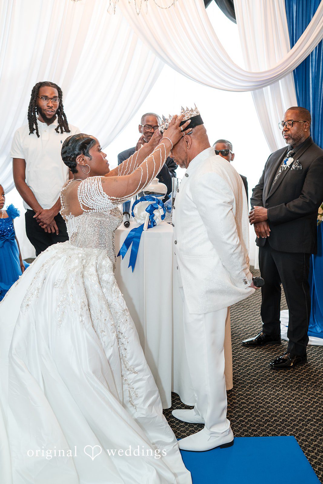 Glen + Constance Our Chicago wedding photographers captured the moment the bride put a crown on the groom's head