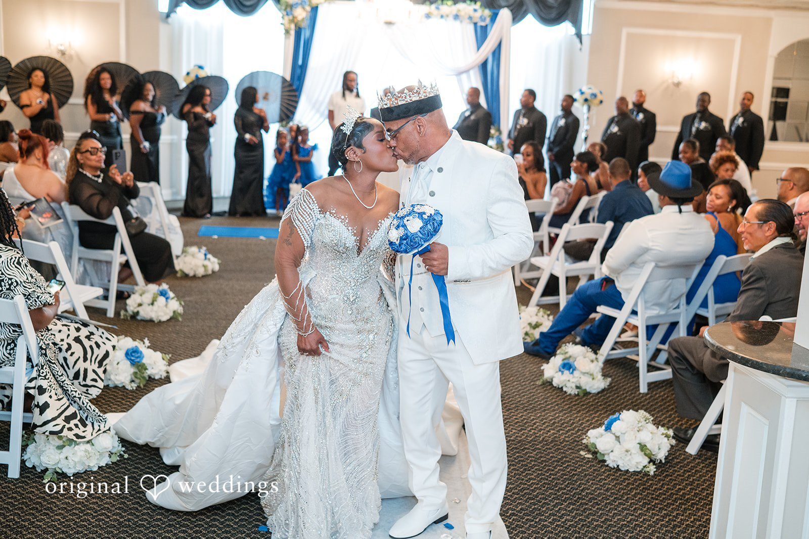 Our Chicago wedding photographers at Original Weddings captured the moment the couple shared a kiss on the aisle at Belle Salle Banquets