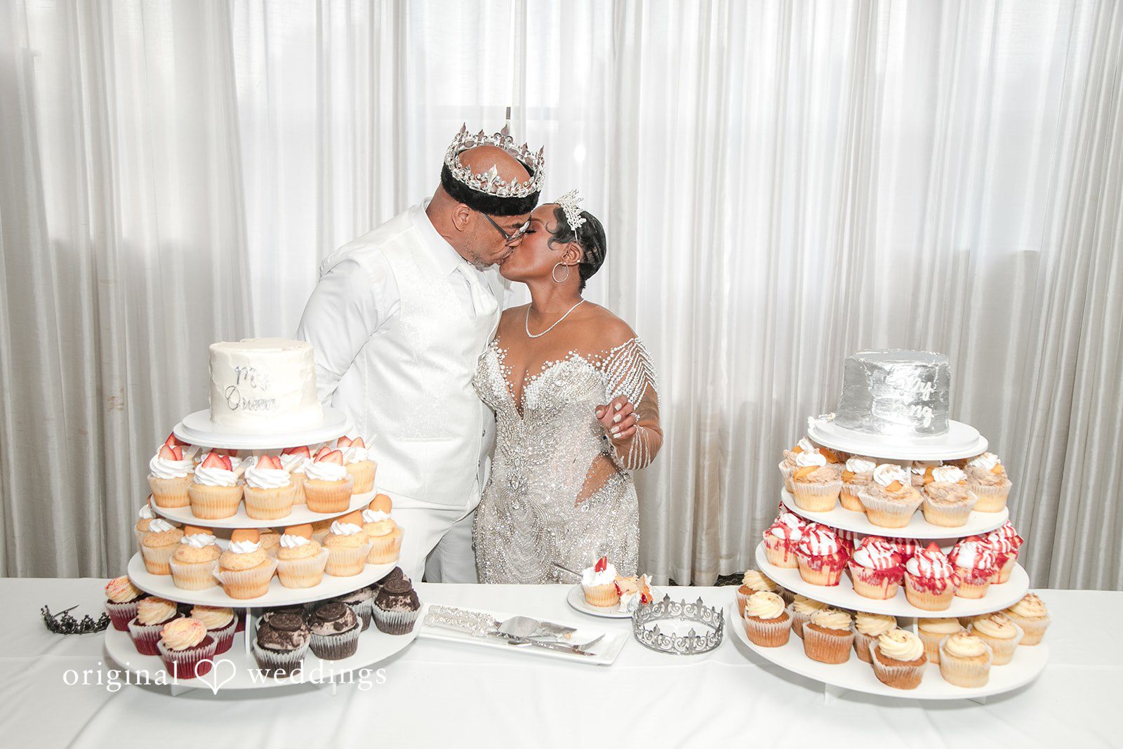 Glen + Constance The couple seals the cake cutting with a kiss