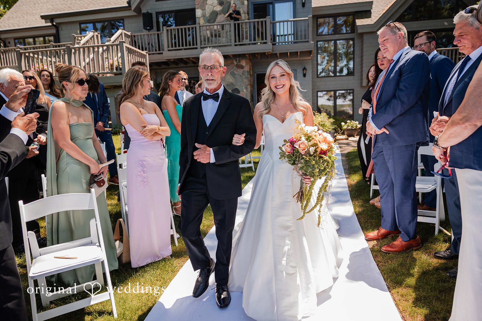 Trey + Bailey Bride walking down the aisle at Blake’s Backyard