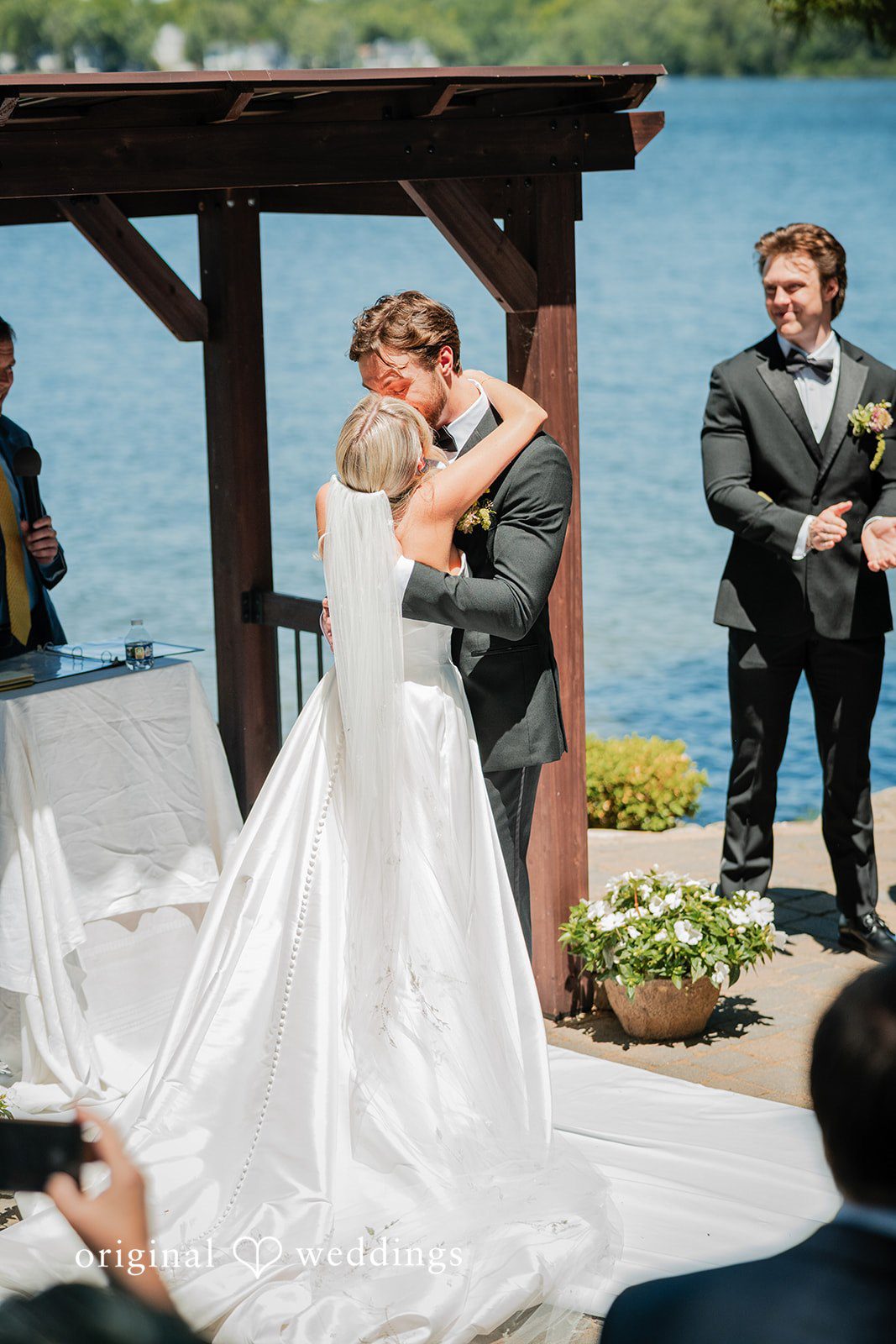 Trey + Bailey Newlyweds celebrating their first kiss at Blake's Backyard