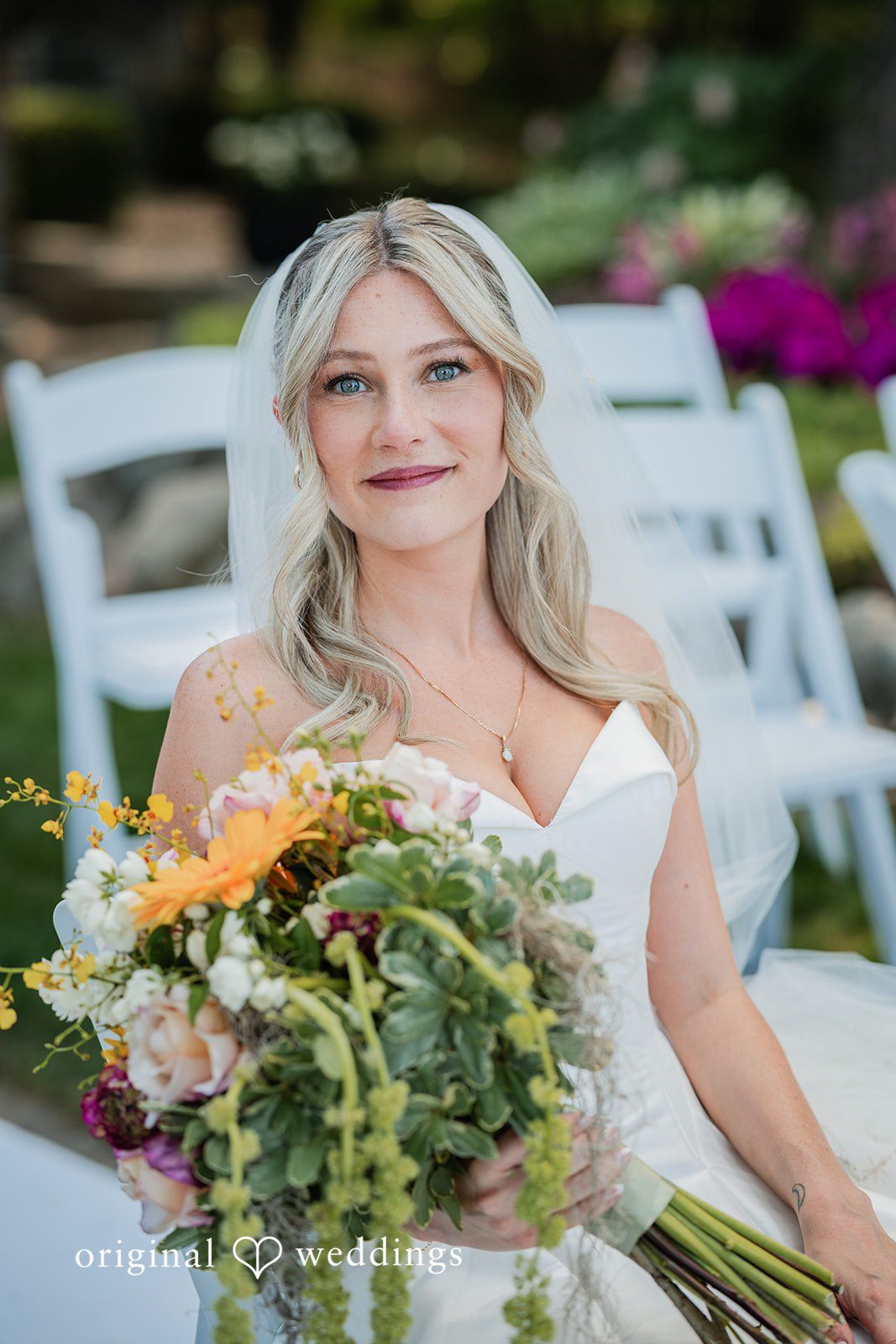 Trey + Bailey Bride holding her bouquet before the ceremony at Blake's Backyard
