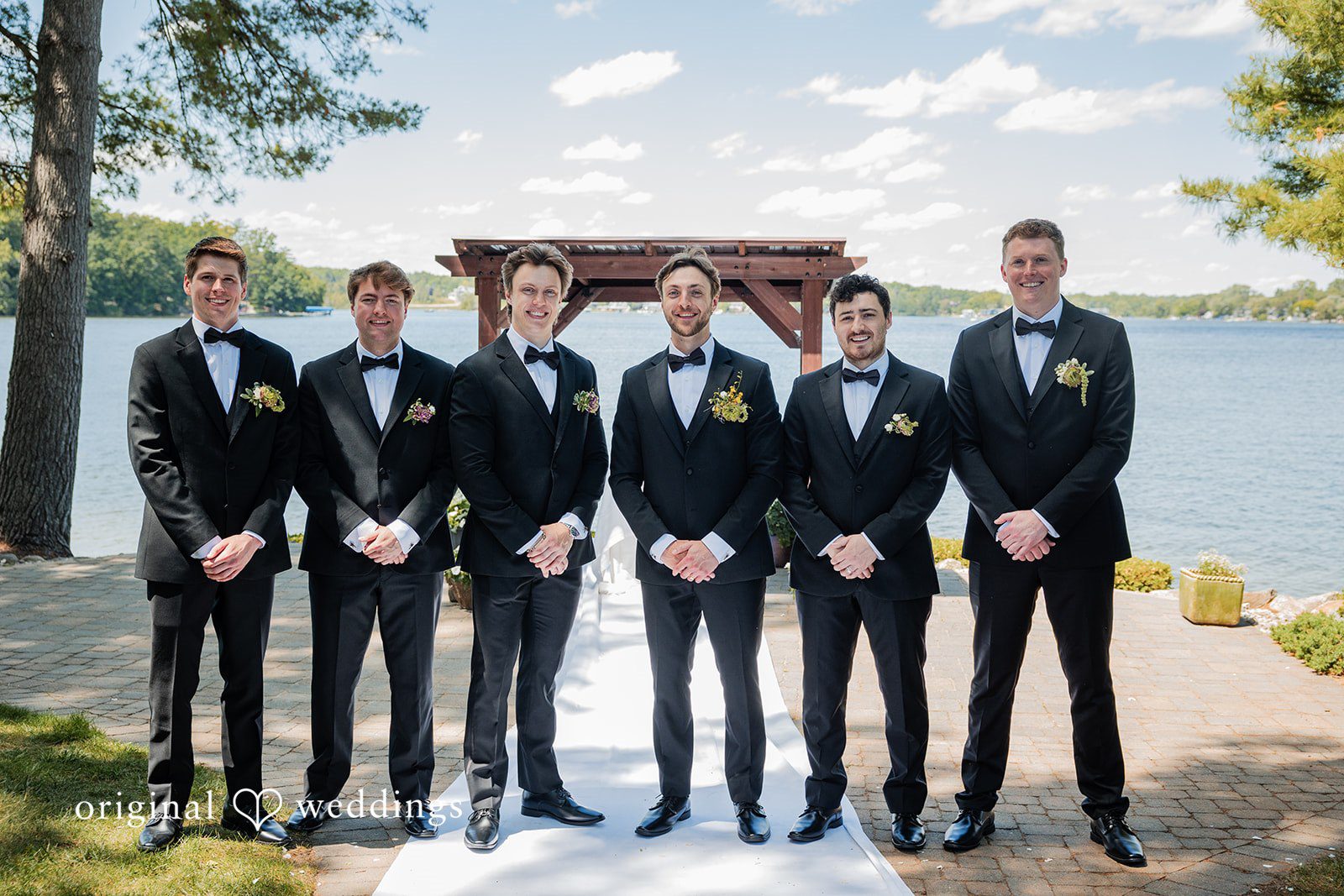 Trey + Bailey Groom with Groomsmen beside the lake at Blake's Backyard
