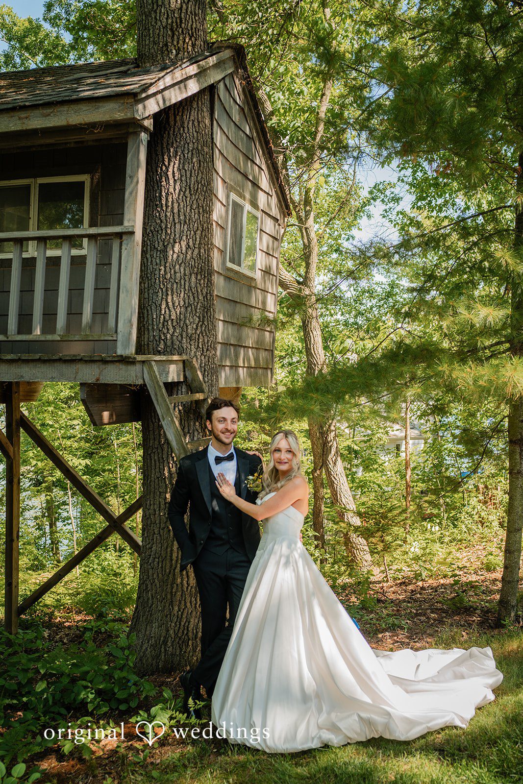 Trey + Bailey Bride and groom beside a rustic treehouse at Blake's Backyard captured by Detroit Wedding Photographers from Original Weddings.