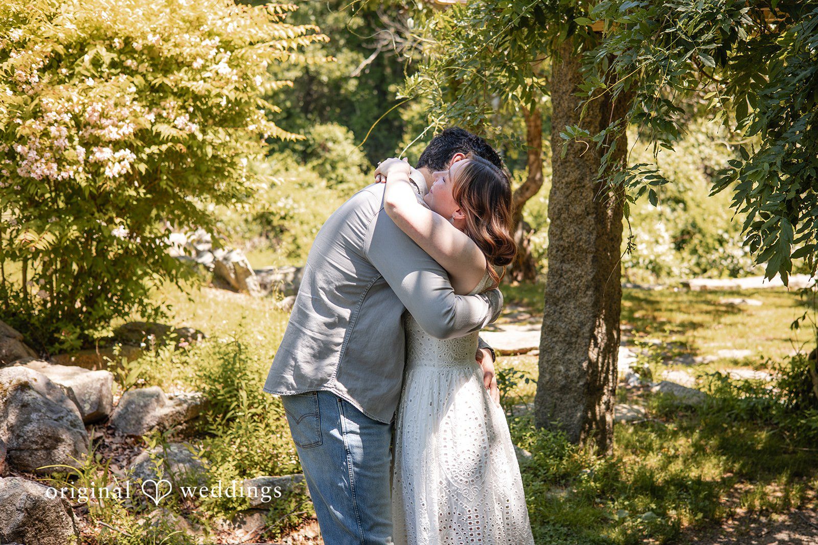 Couple sharing a warm hug during their engagement session at Borderland State Park