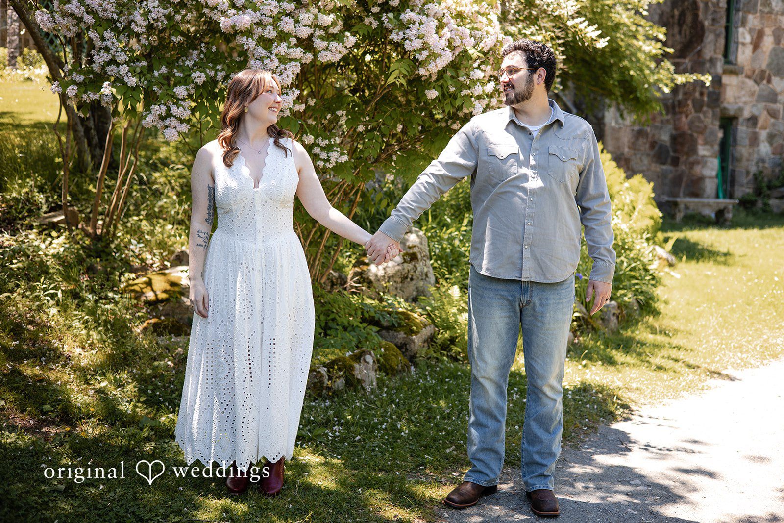 Couple holding hands and looking at each other at Borderland State Park by Original Weddings