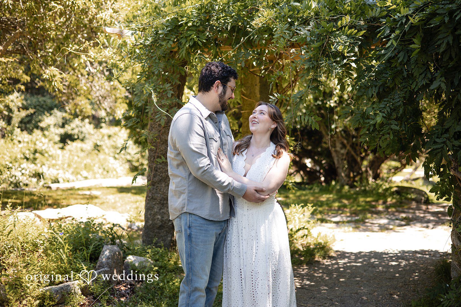 Engagement photography of couple looking at each other while smiling at Borderland State Park