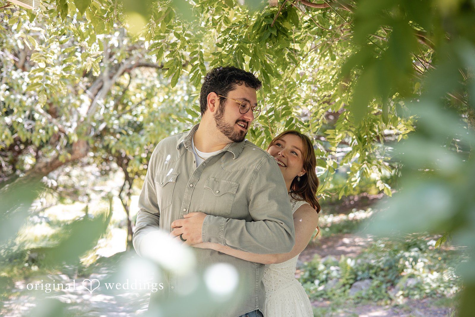 Romantic back hug engagement photography at Borderland State Park