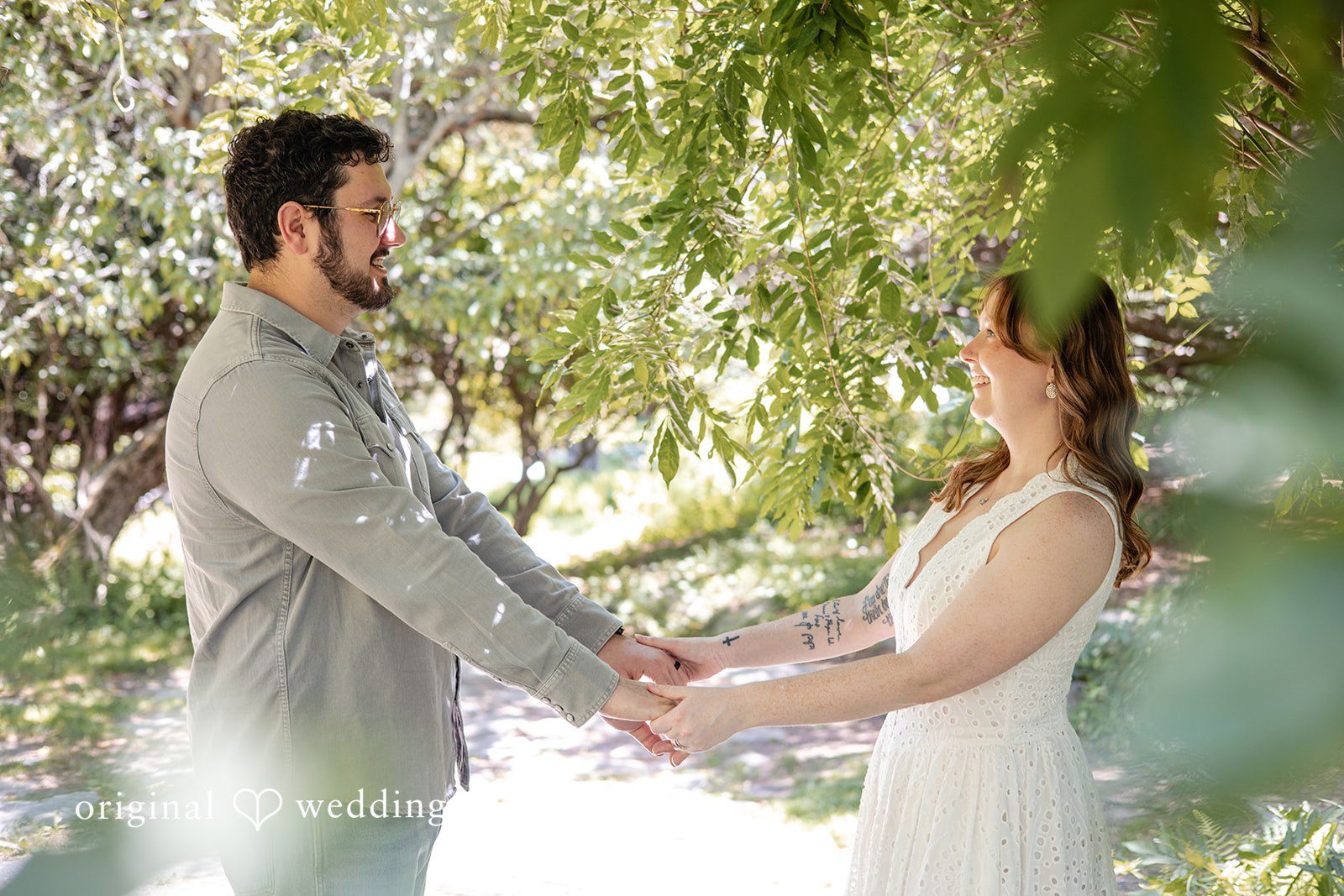 Couple holding hands and looking at each other at Borderland State Park