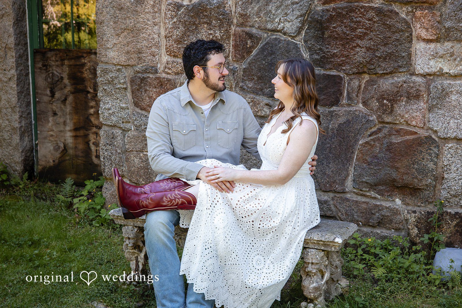 Couple sitting side by side during their engagement session at Borderland State Park