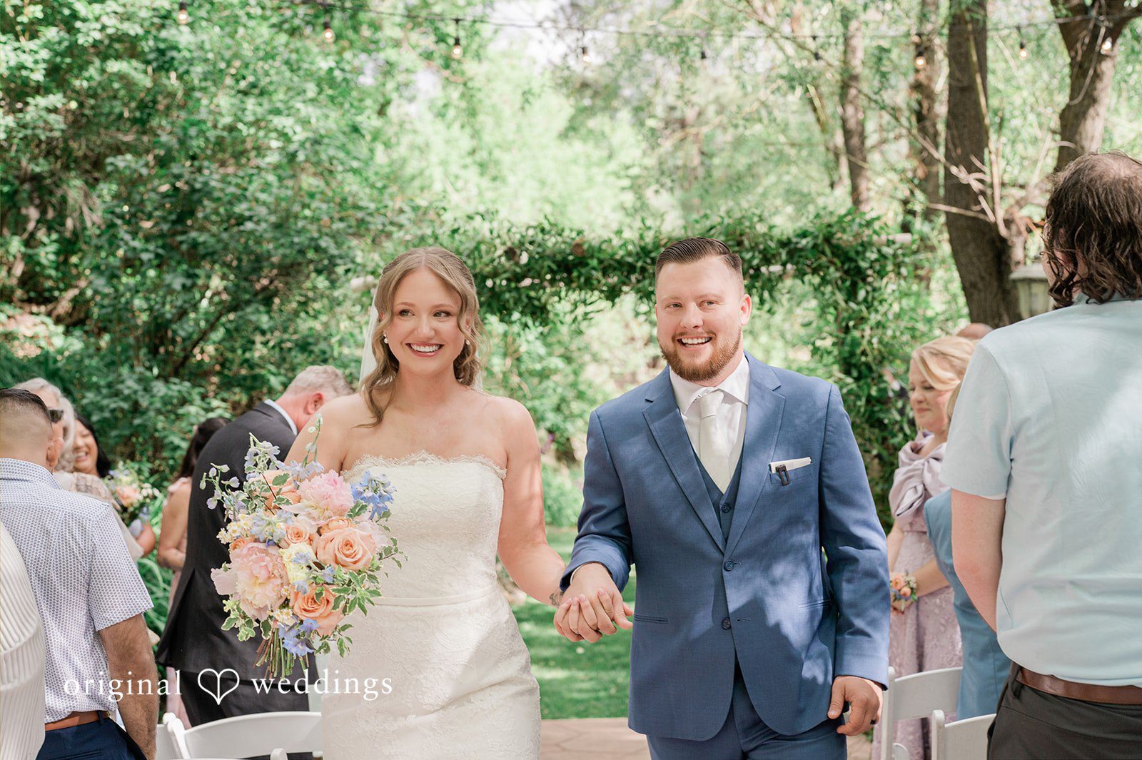 Bonnie + Tommie Our Denver wedding photographers captured the moment the couple made a joyful exit