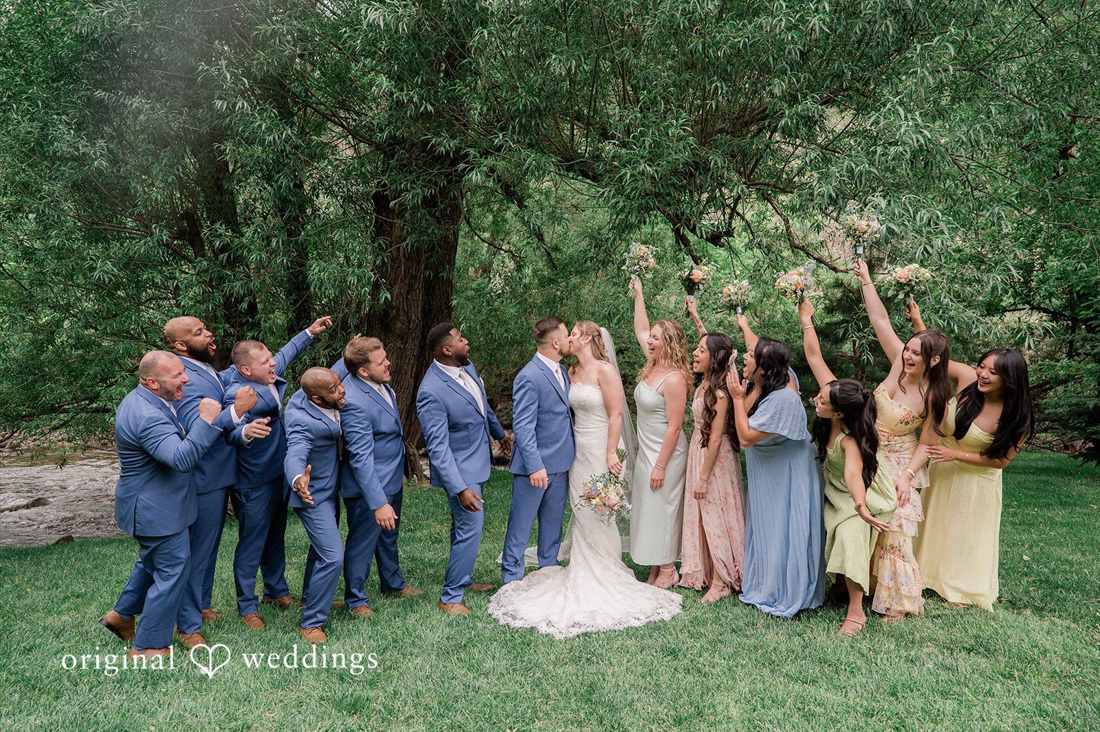 Bonnie + Tommie Our Denver wedding photographers captured a romantic portrait of the couple and their bridal party at Boulder Creek