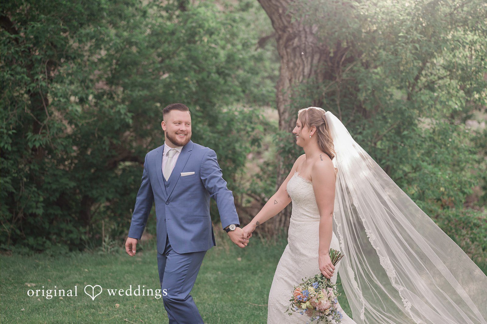 Bonnie + Tommie Our Denver wedding photographers at Original Weddings captured a stunning portrait of the couple at the field at Boulder Creek