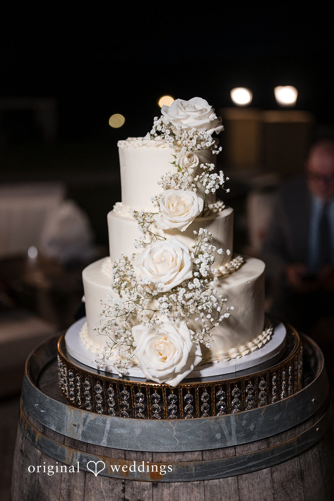 Brett + Ava Wedding cake decorated with beautiful flowers at Breaux Vineyards
