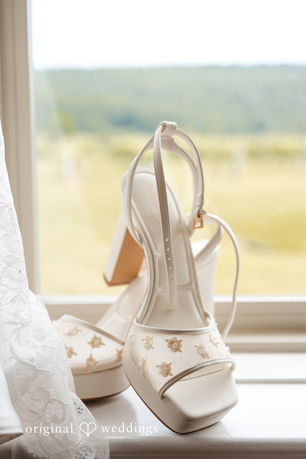 Brett + Ava Close up shot of bridal shoes at Breaux Vineyards