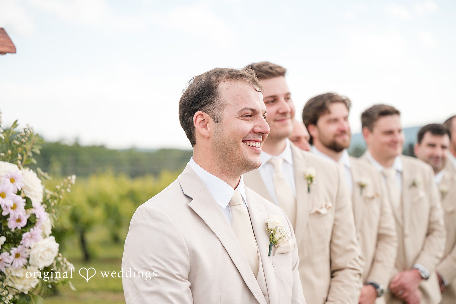 Brett + Ava Groom waiting for the bride joyfully at Breaux Vineyards