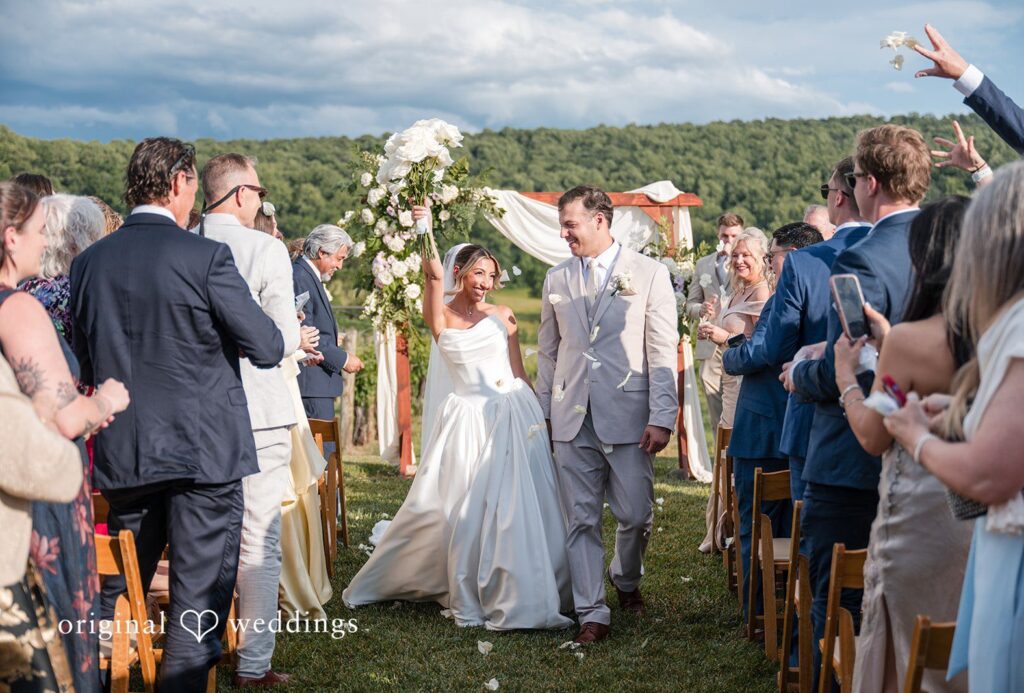 Brett + Ava Bride and groom leaving the altar with happiness at Breaux Vineyards captured by DC wedding photographers from Original Weddings