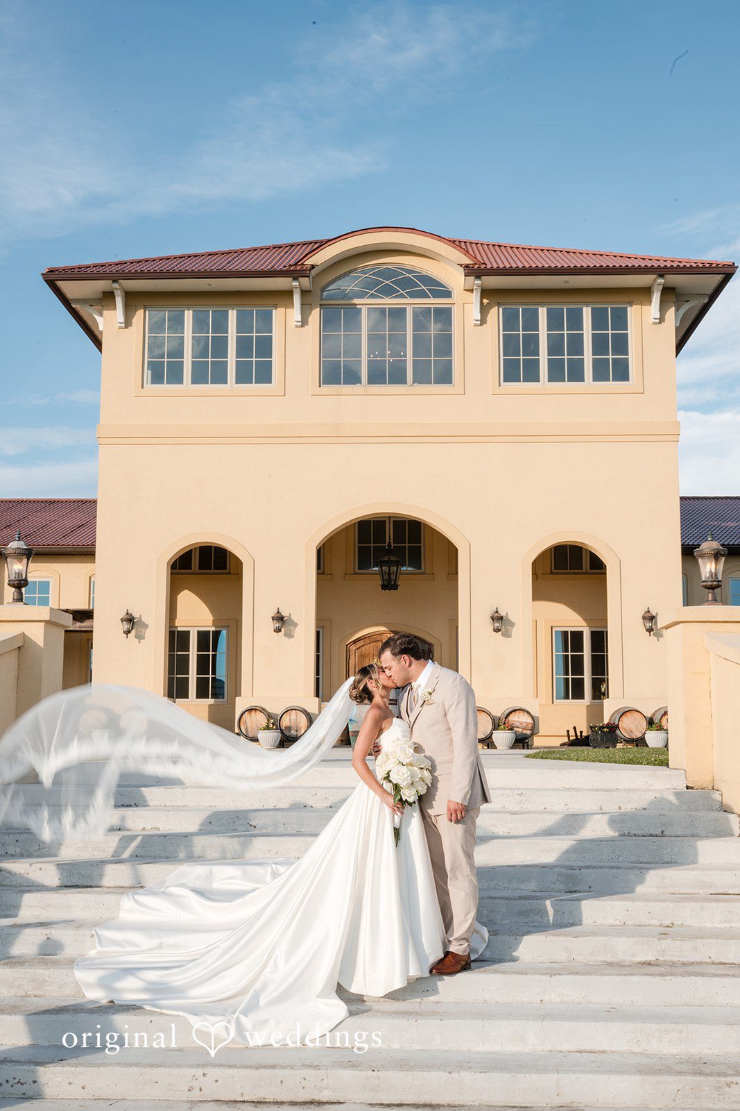 Brett + Ava Stunning portrait of couple at Breaux Vineyards sharing a kiss
