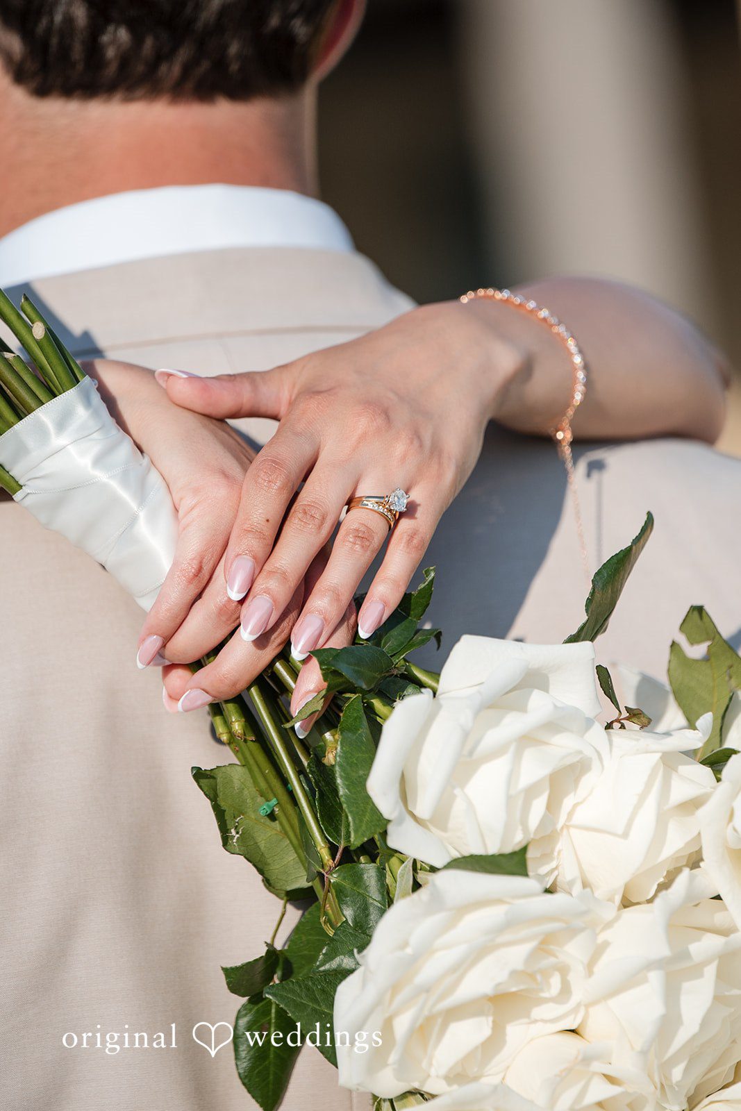 Brett + Ava Lovely picture of bride's hands with wedding ring on it