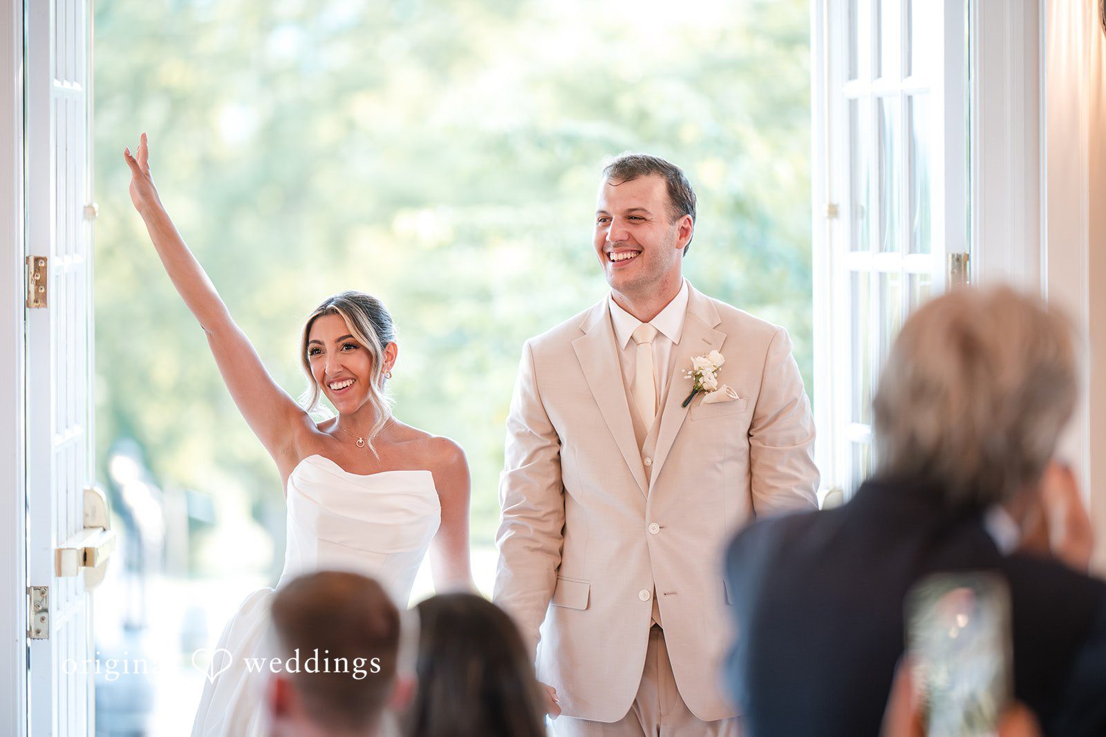 Brett + Ava Lovely couple entering to the wedding reception hall