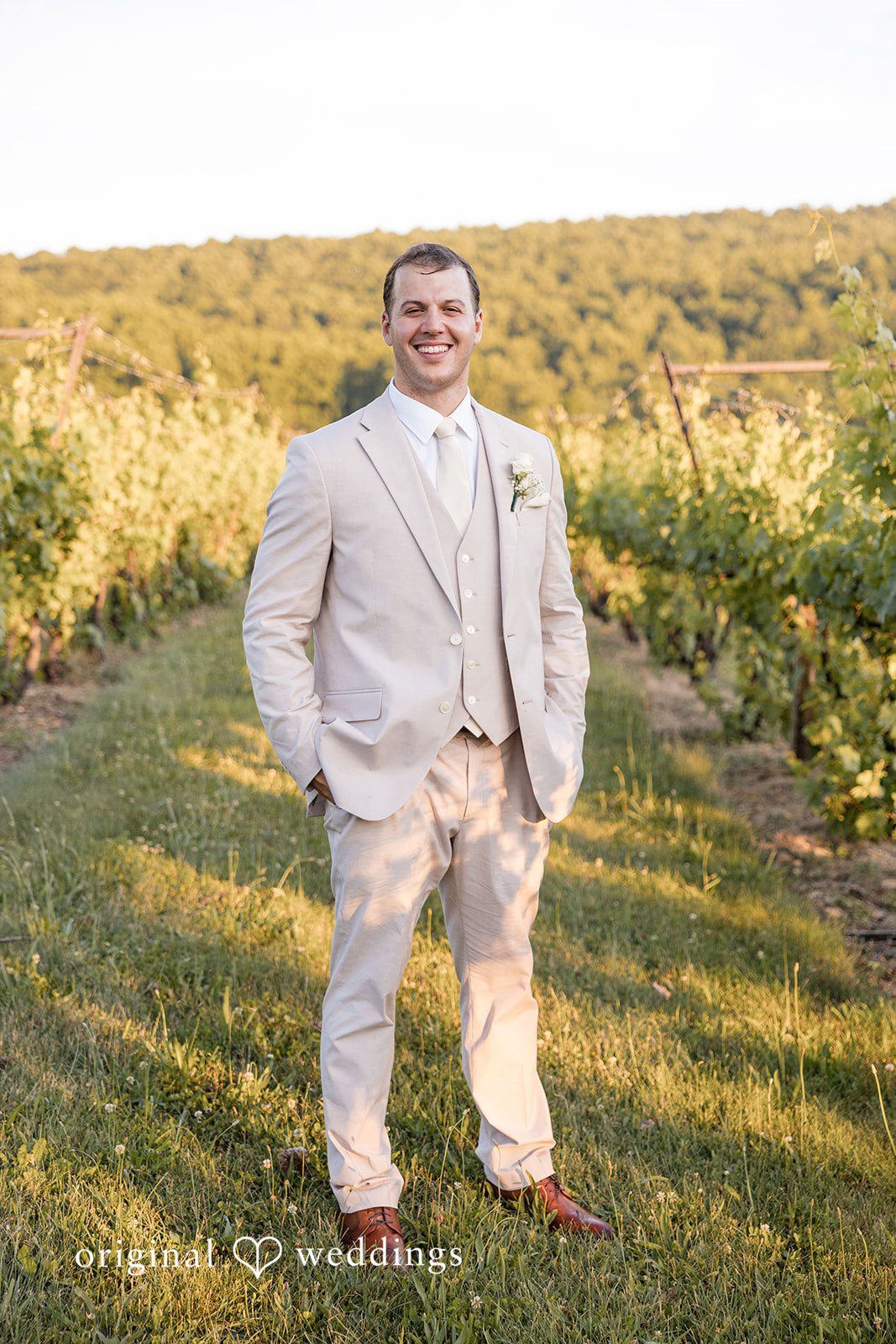 Brett + Ava Elegant picture of groom in his wedding attire at Breaux Vineyards