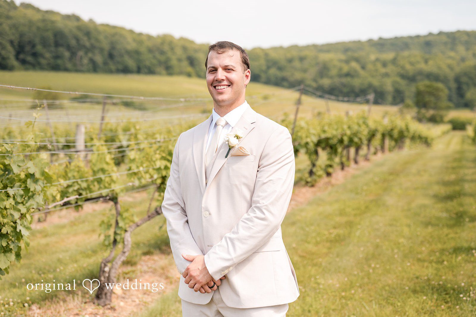 Brett + Ava Elegant picture of groom in his wedding attire at Breaux Vineyards