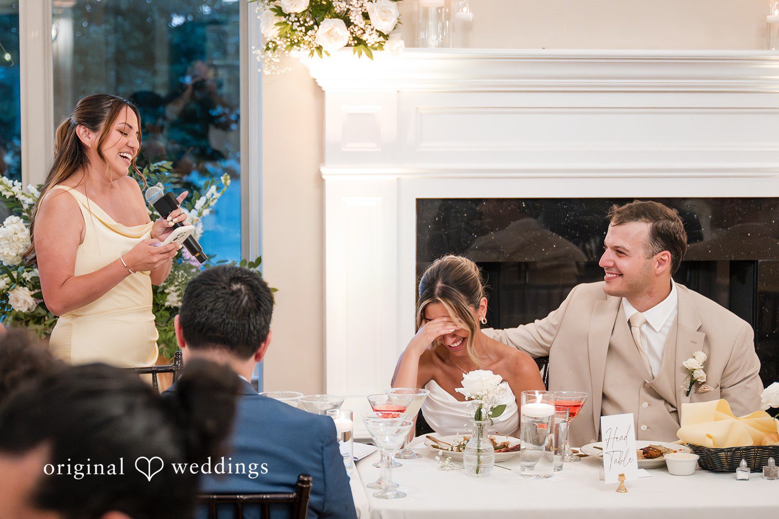 Brett + Ava Couple listening to the speech of a guest at Breaux Vineyards