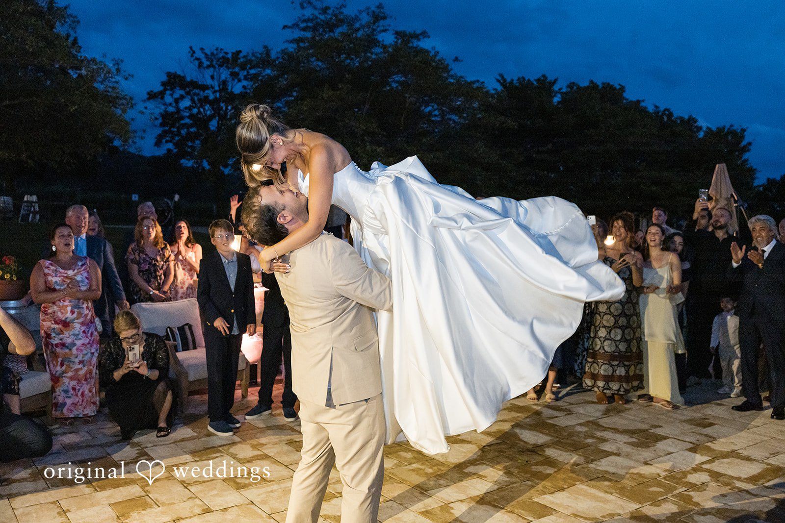 Brett + Ava Groom lifting up the bride at Breaux Vineyards