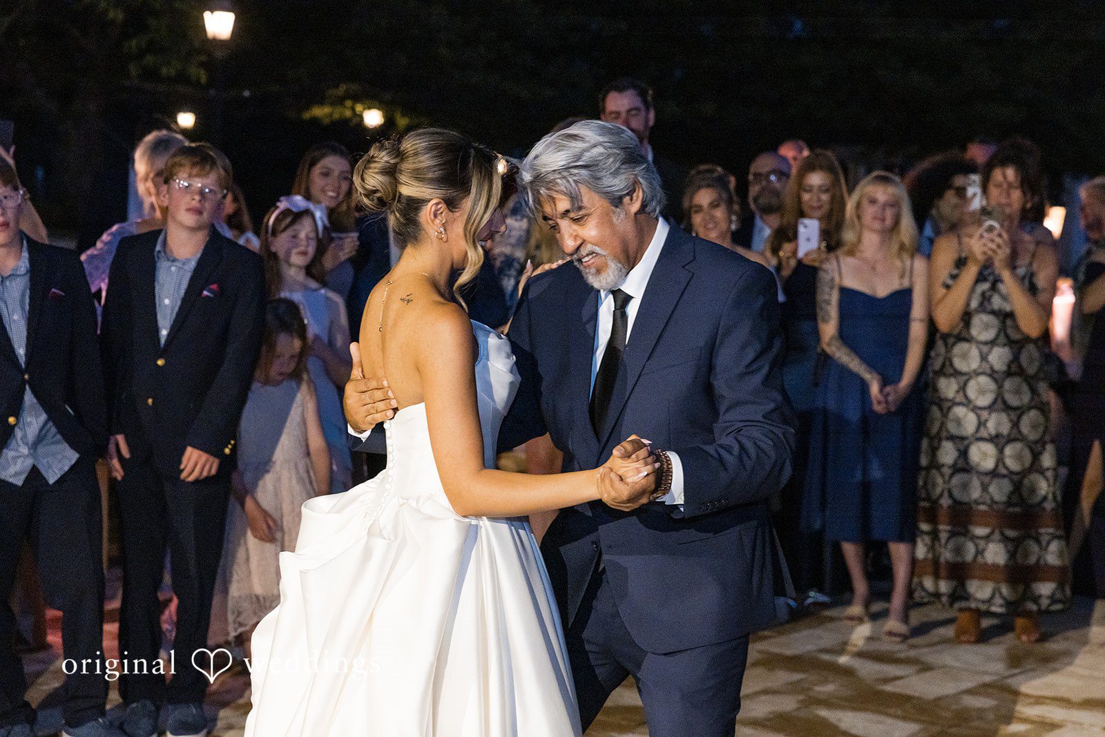 Brett + Ava Bride sharing a dance with someone at Breaux Vineyards