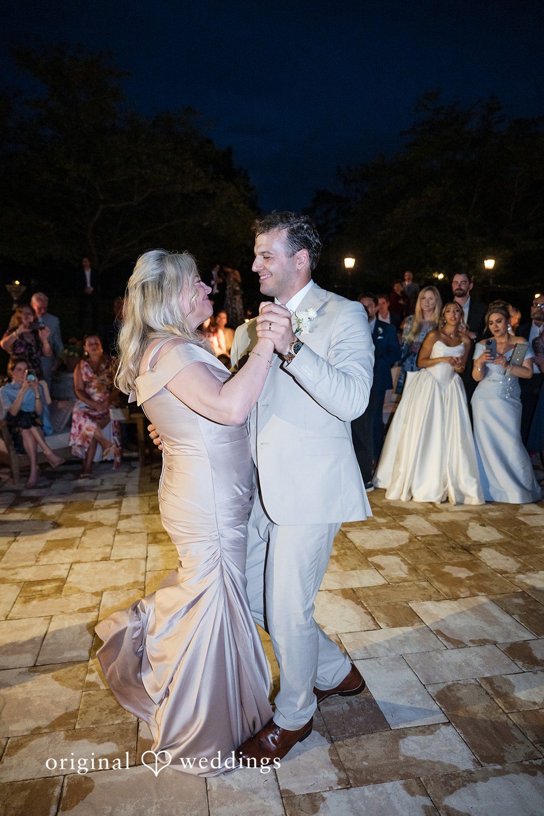 Brett + Ava Groom sharing a dance with someone at Breaux Vineyards