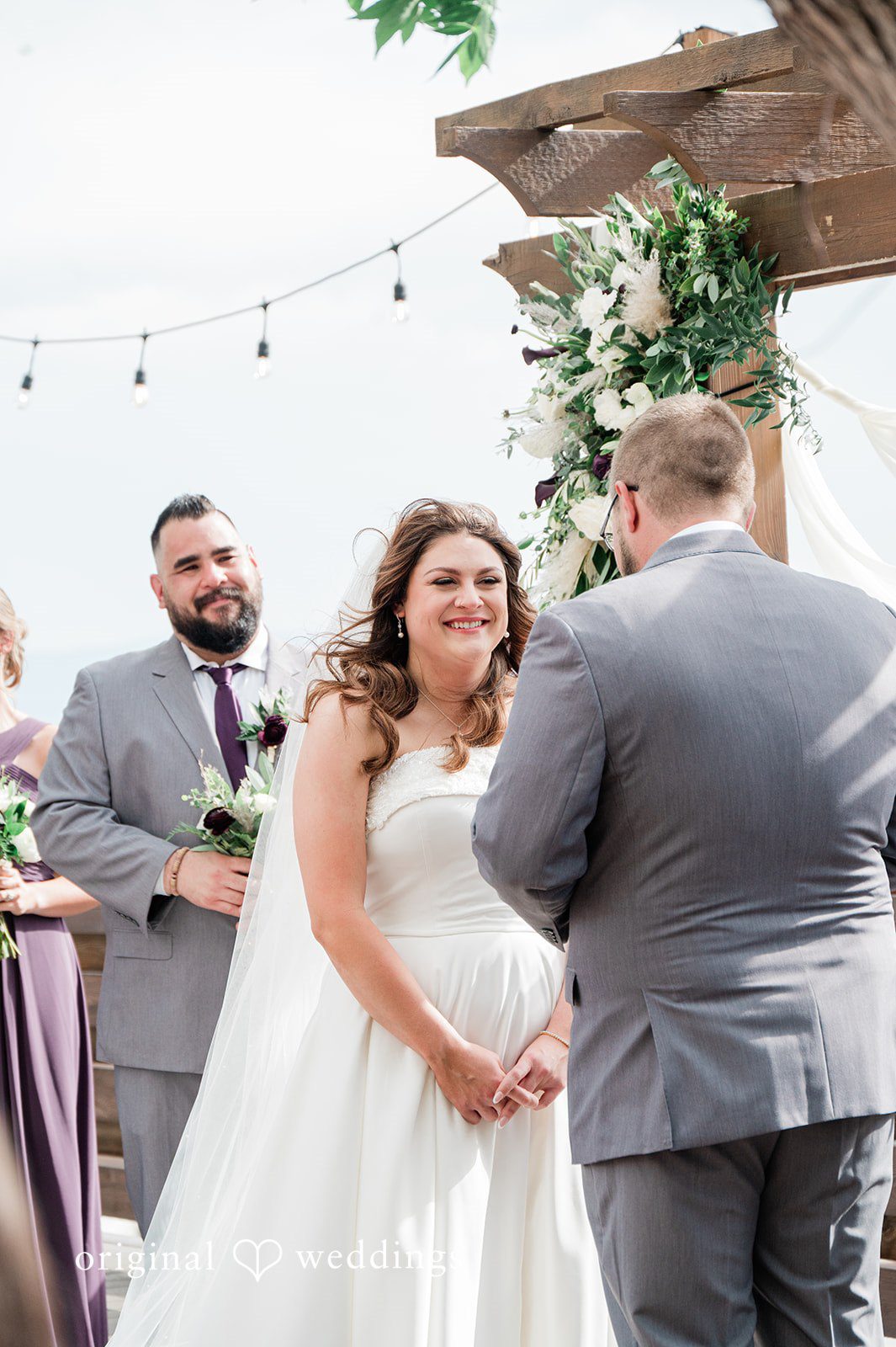 Carolina + Jonah Couple standing together before the officiant at Brittany Hill - Wedgewood Weddings