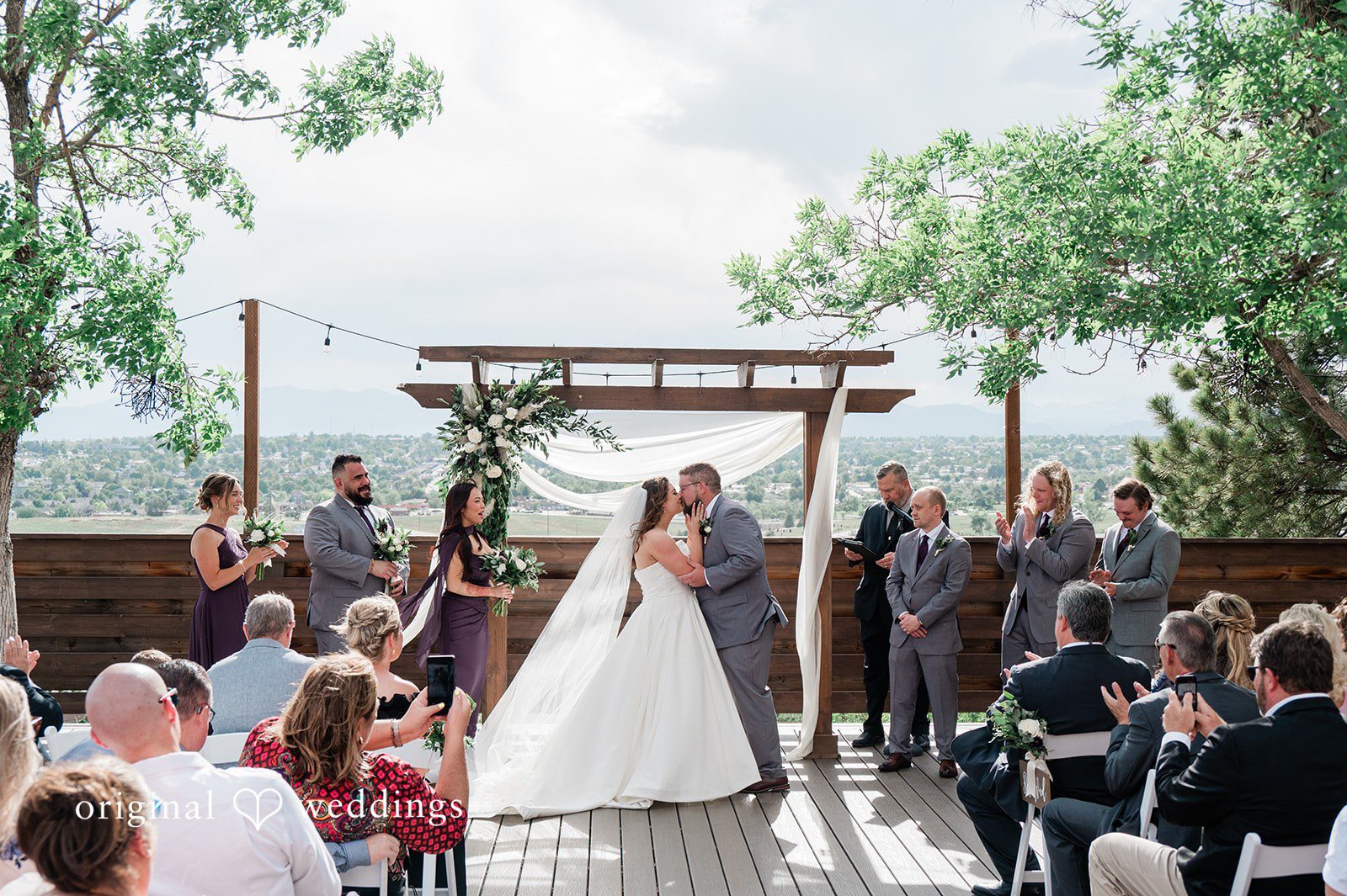 Carolina + Jonah Couple kissing during the ceremony at Brittany Hill - Wedgewood Weddings