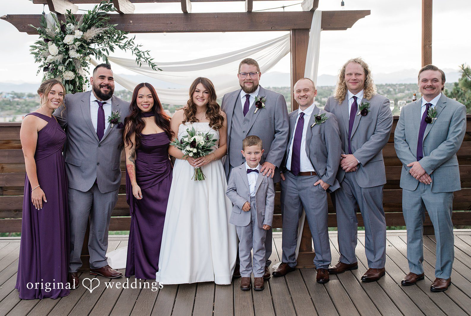 Denver Wedding Photographers capturing couple with bridesmaids and groomsmen at Brittany Hill - Wedgewood Weddings by Original Weddings