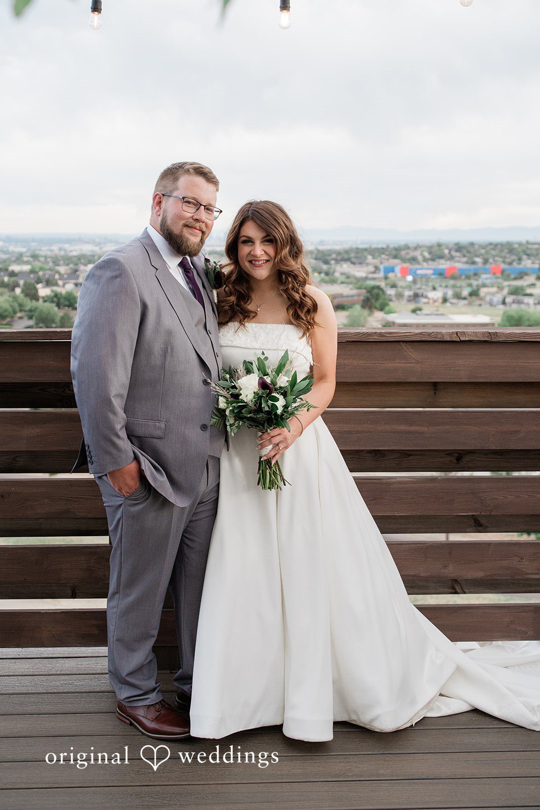 Carolina + Jonah Denver Wedding Photographers capturing couple smiling at the camera at Brittany Hill - Wedgewood Weddings by Original Weddings