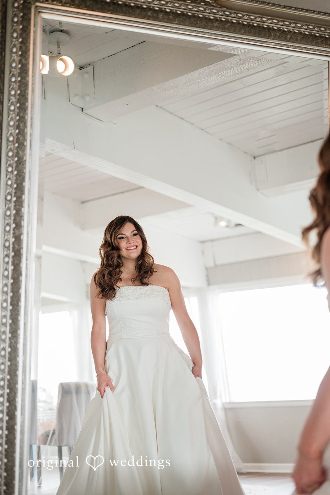 Carolina + Jonah Bride looking into the mirror while getting ready at Brittany Hill - Wedgewood Weddings