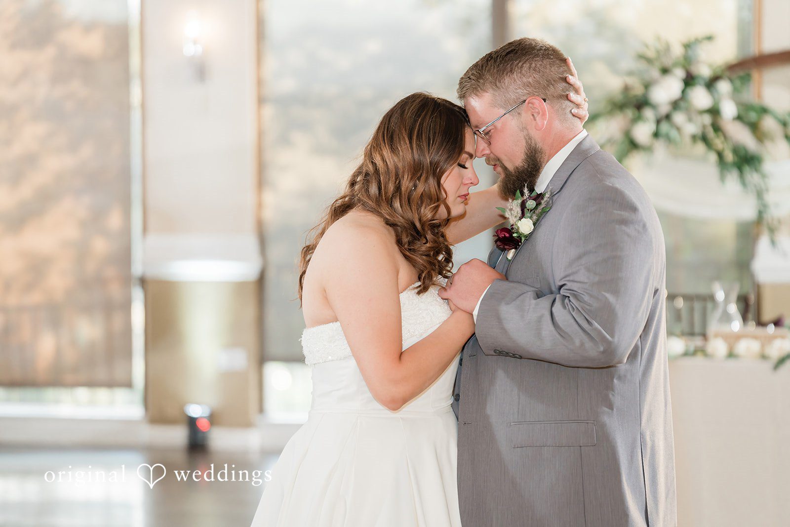 Carolina + Jonah Couple sharing an intimate moment with their heads together at Brittany Hill - Wedgewood Weddings