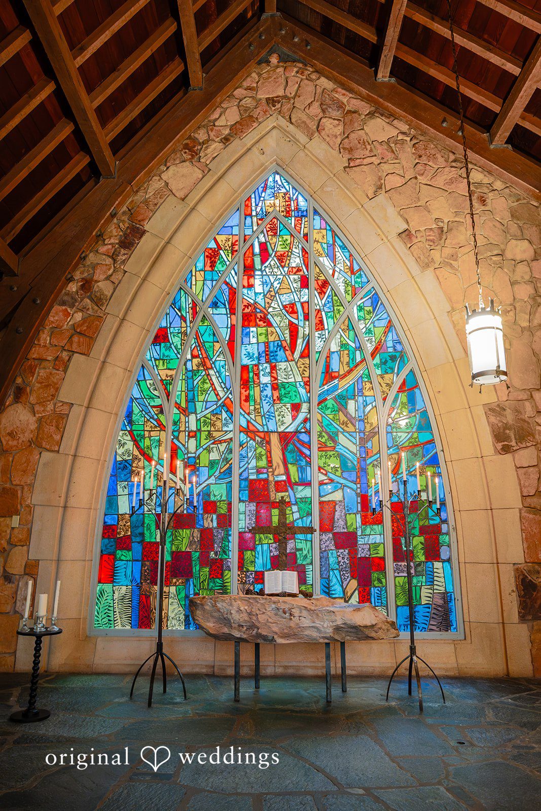 Jacob + Jadee Atlanta Wedding Photographers at Callaway Gardens Ida Memorial Chapel showcasing the chapel's colorful stained glass by Original Weddings