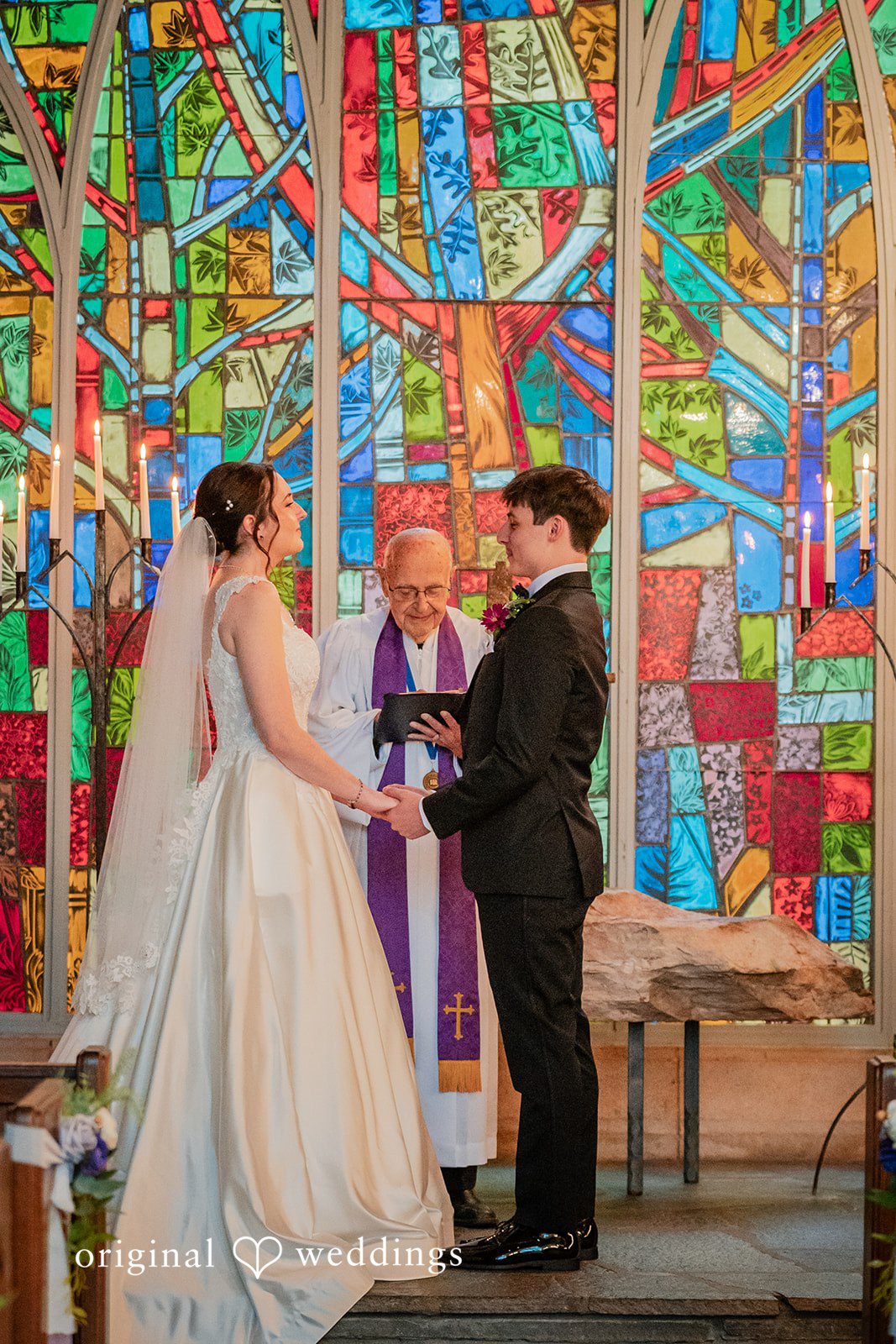 Jacob + Jadee Romantic wedding ceremony beneath the chapel's stained glass windows at Callaway Gardens Ida Memorial Chapel