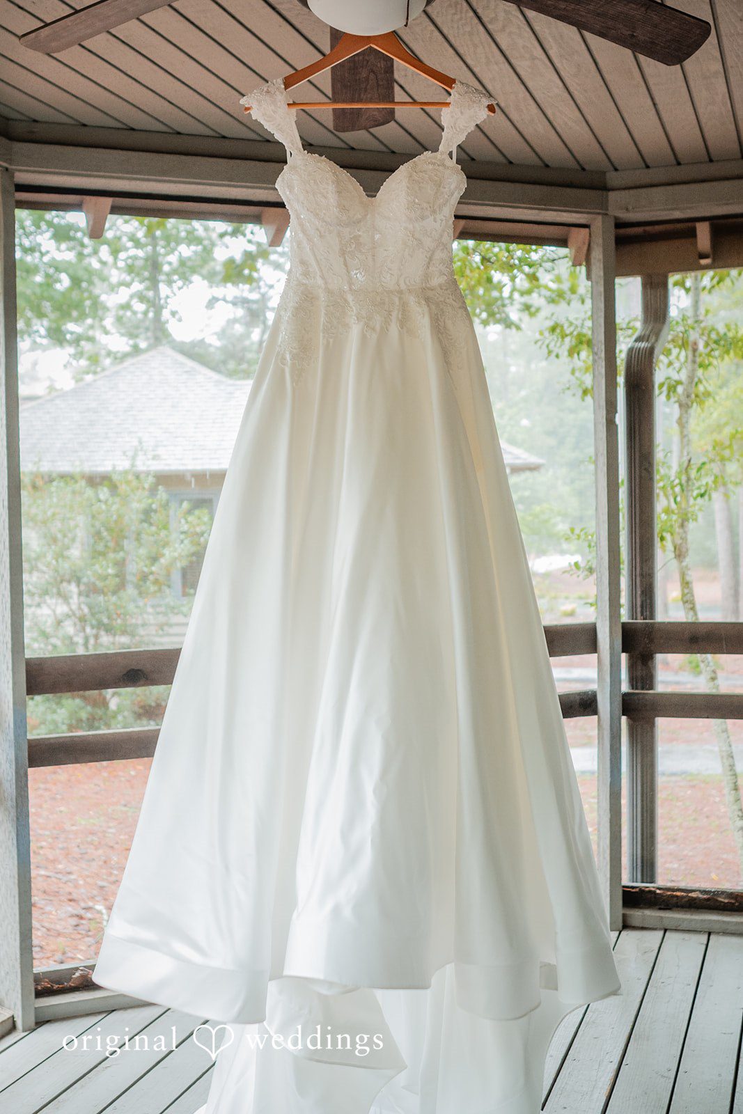 Jacob + Jadee Beautiful bridal gown displayed before the wedding celebration at Callaway Gardens Ida Memorial Chapel