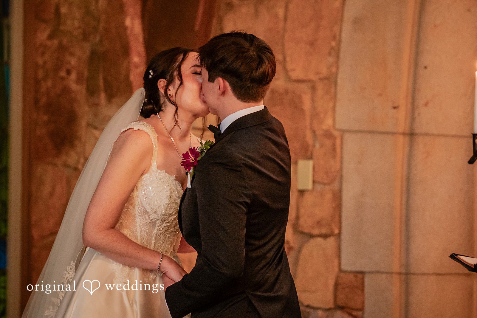 Jacob + Jadee Bride and groom celebrating their marriage with a kiss at Callaway Gardens Ida Memorial Chapel