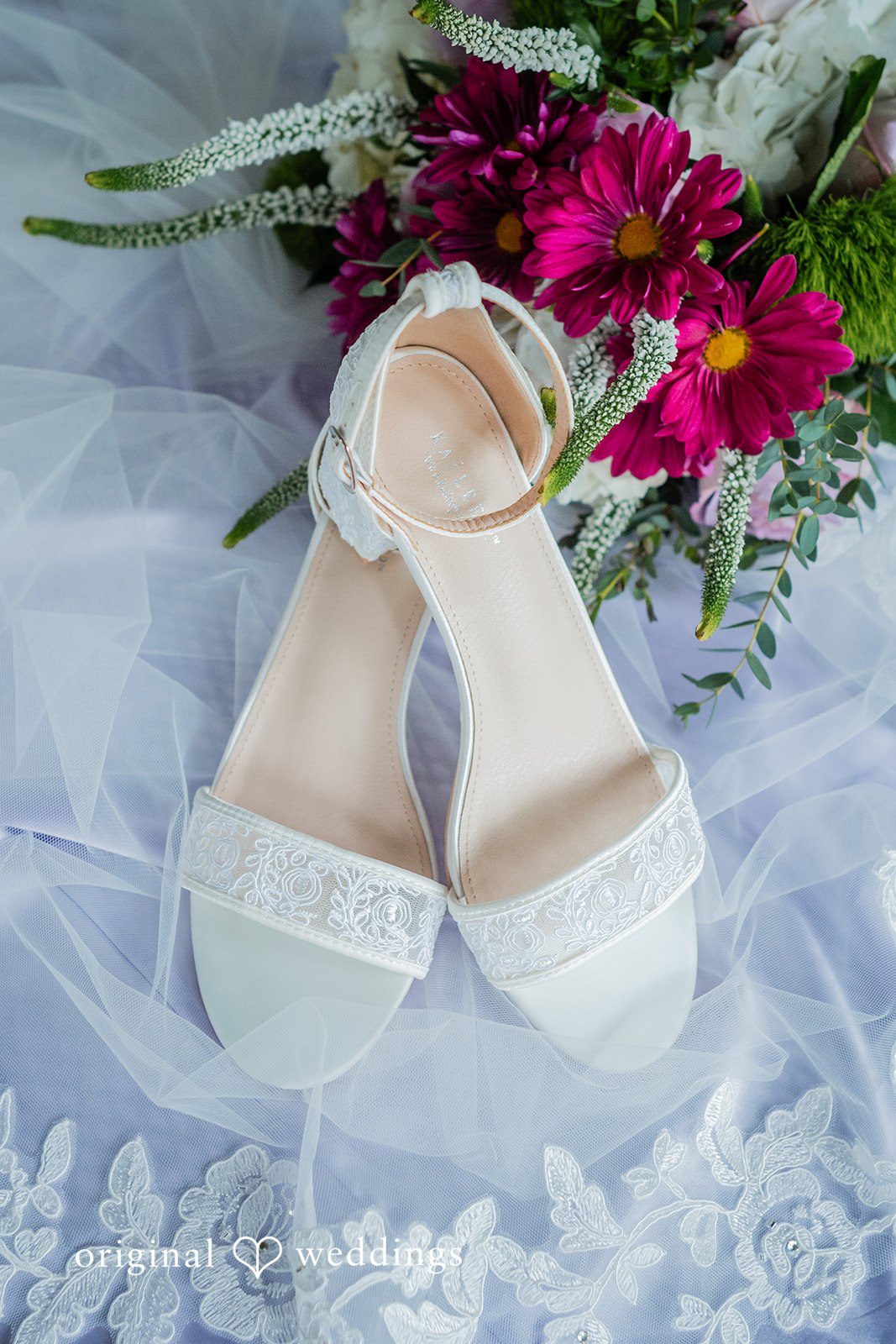 Jacob + Jadee White bridal shoes arranged with a vibrant wedding bouquet at Callaway Gardens Ida Memorial Chapel