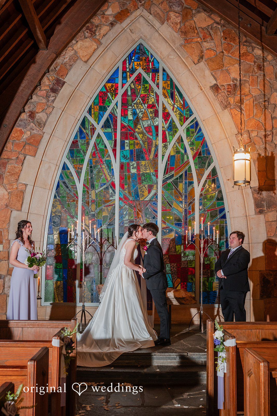 Jacob + Jadee Newlyweds sharing their first kiss at Callaway Gardens Ida Memorial Chapel