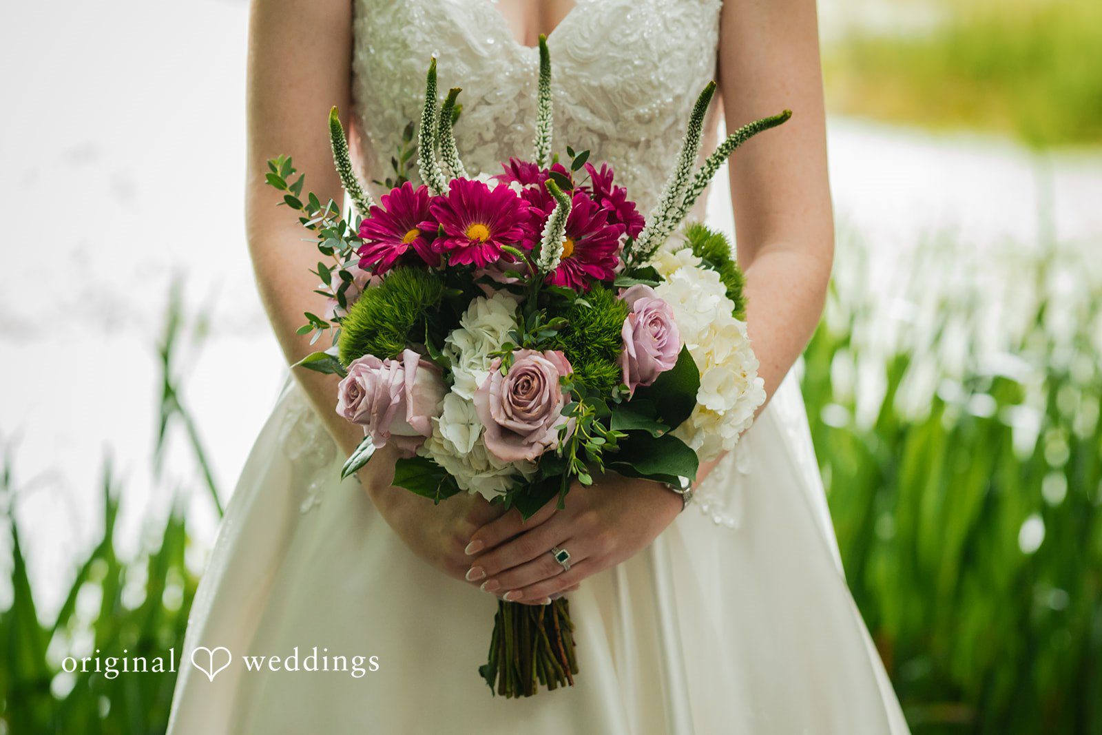 Jacob + Jadee Close-up of the bride holding vibrant wedding flowers at Callaway Gardens Ida Memorial Chapel