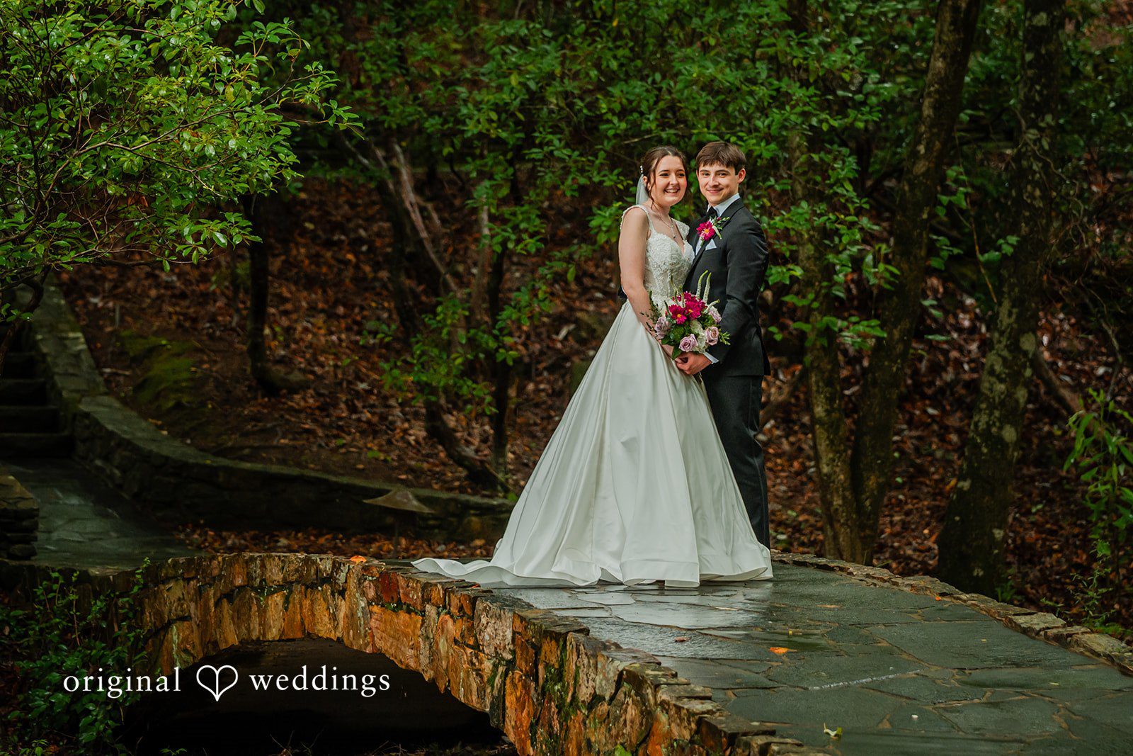 Jacob + Jadee Bride and groom smiling on the bridge at Callaway Gardens Ida Memorial Chapel captured by Atlanta Wedding Photographers from Original Weddings.