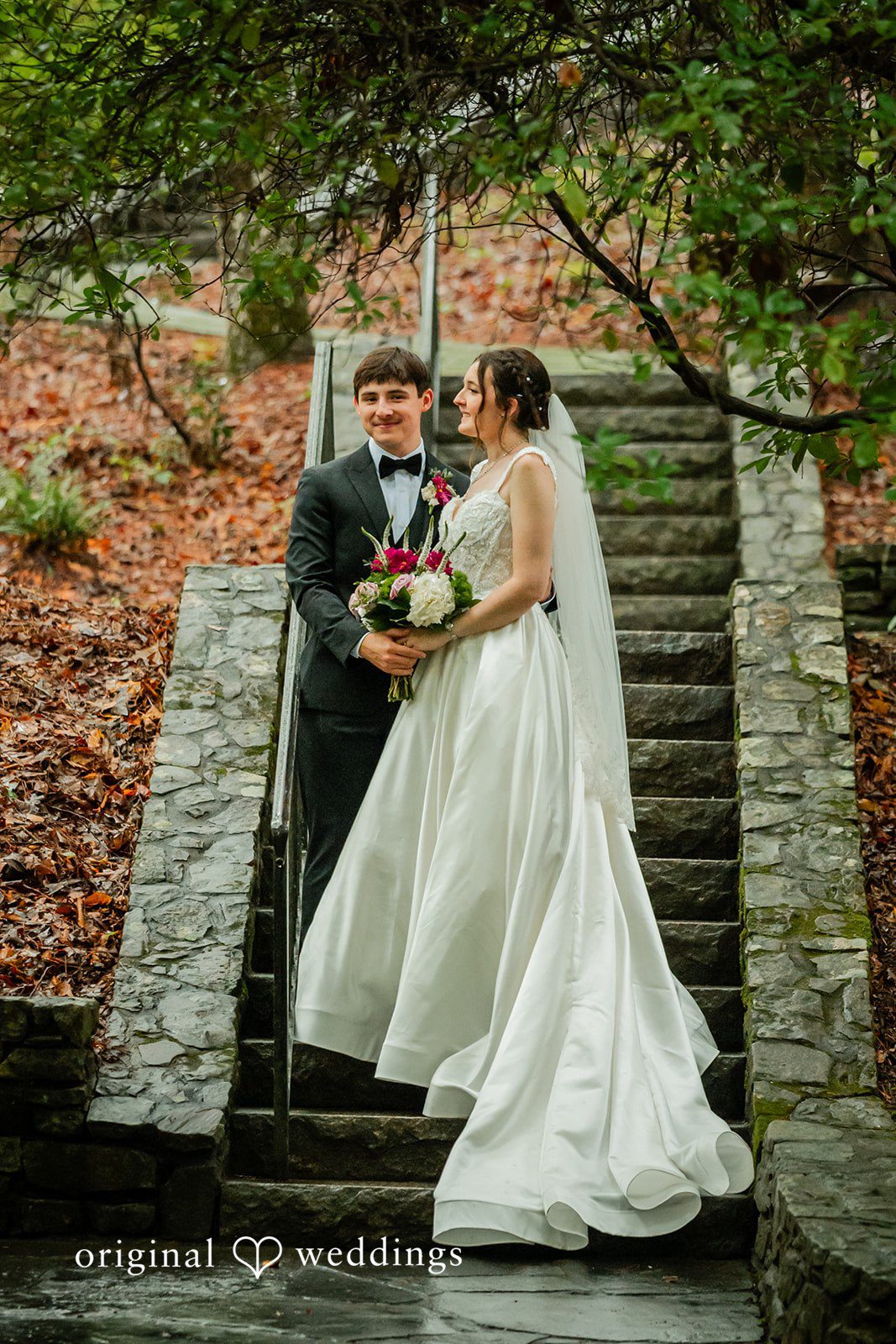 Jacob + Jadee Wedding portrait on the historic stone staircase at Callaway Gardens Ida Memorial Chapel.