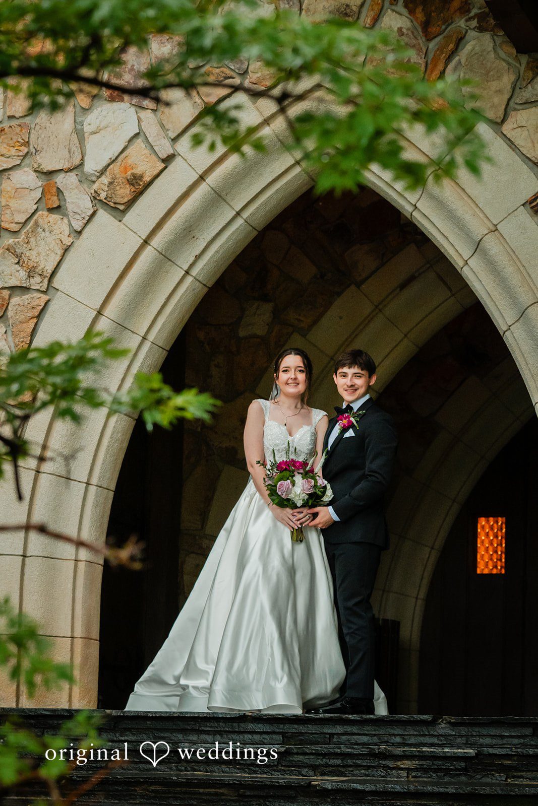 Jacob + Jadee Bride and groom beneath the chapel arch at Callaway Gardens Ida Memorial Chapel captured by Atlanta Wedding Photographers from Original Weddings.