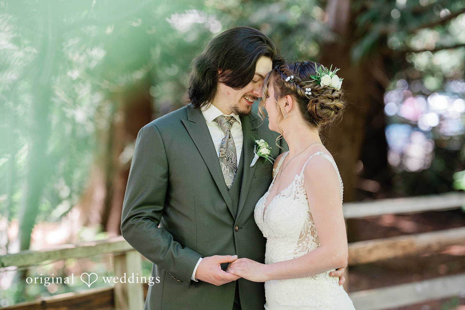Jennifer + Steven Bride and groom touching their foreheads together and smiling at cedar springs