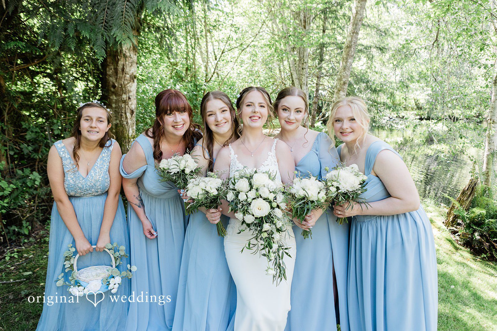 Jennifer + Steven Bride posing with bridesmaids holding bouquets at cedar springs