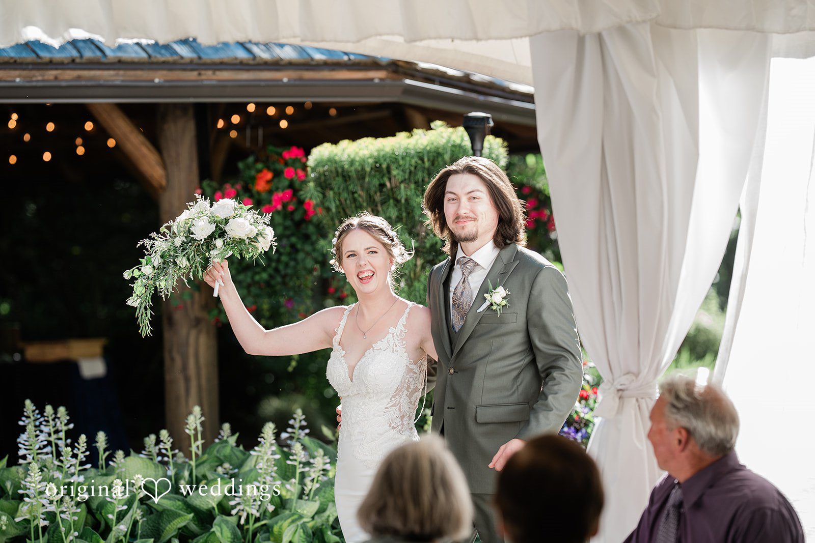 Jennifer + Steven Seattle wedding photographers capturing couple entering the reception at cedar springs by Original Weddings