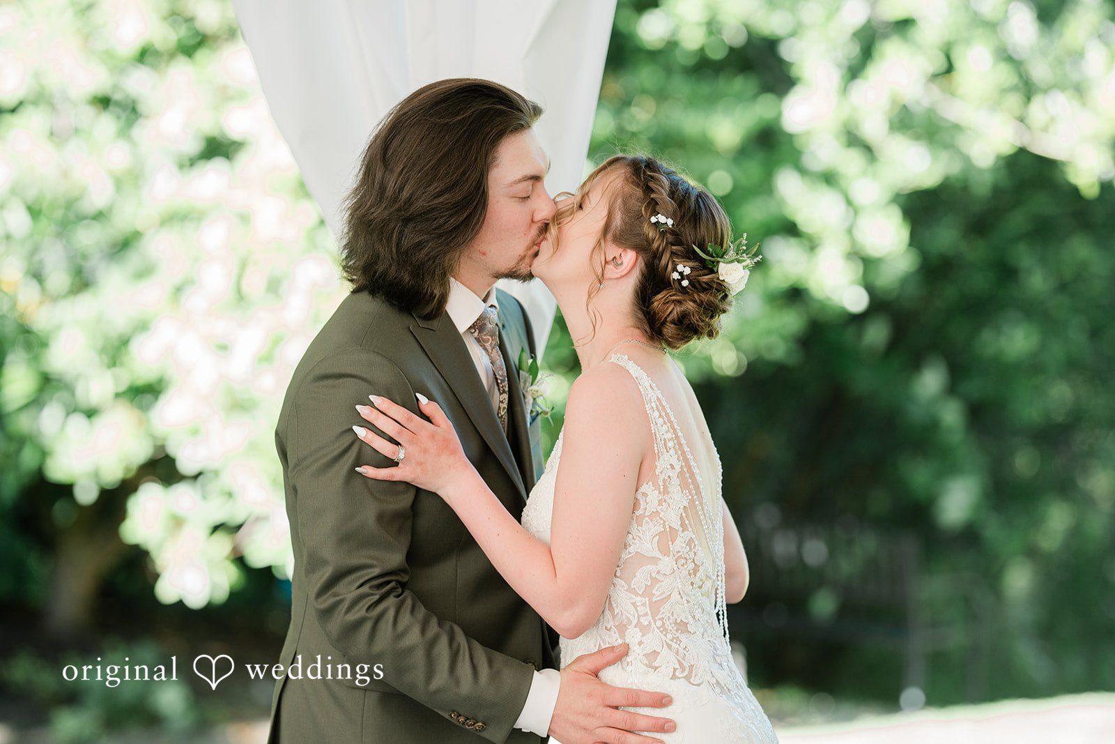Jennifer + Steven Bride and groom sharing a kiss at cedar springs